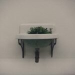 white ceramic bowl on black wooden table